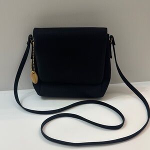 Liz Claiborne Elegant Black Crossbody Bag. Gold colored accents. Skinny strap.